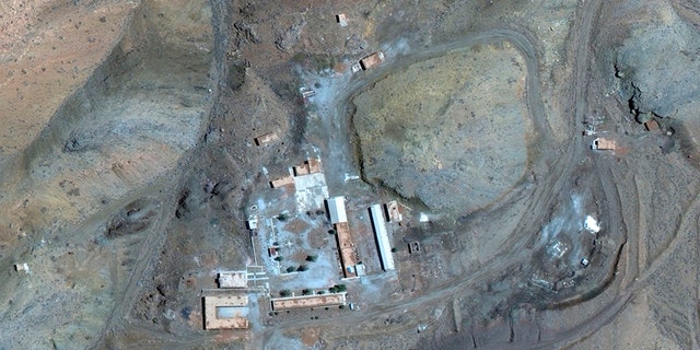 A March 27 satellite image of the Iranian site provided by Maxar Technologies shows a compound with a series of buildings surrounding a courtyard, with other smaller structures away from it.