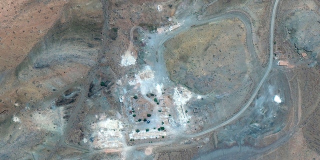 An Aug. 12 satellite image of the same site shows many of its buildings destroyed.