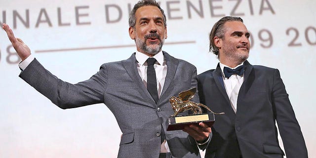 Director Todd Phillips, left, holds the Golden Lion for Best Film for "Joker," joined by lead actor Joaquin Phoenix at the closing ceremony of the 76th edition of the Venice Film Festival in Italy back in September.