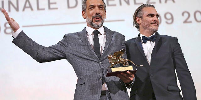 Director Todd Phillips, left, holds the Golden Lion for Best Film for "Joker," joined by lead actor Joaquin Phoenix at the closing ceremony of the 76th edition of the Venice Film Festival in Italy back in September.