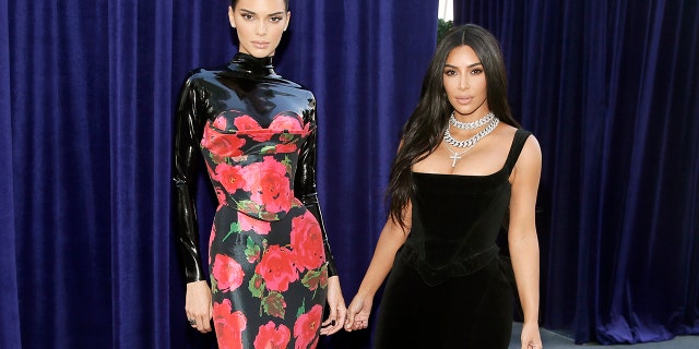 Kendall Jenner continued to post pictures from Kim Kardashian's lavish birthday party amid backlash.