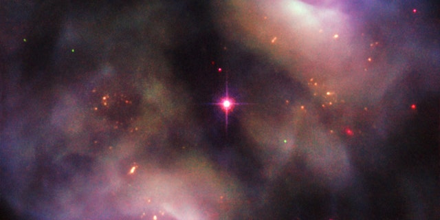 This image, taken with the NASA/ESA Hubble Space Telescope, shows a dark, gloomy scene in the constellation of Gemini. It confused astronomers when it was first studied. Instead of being classified as a single object, it was recorded as two objects, owing to its symmetrical lobed structure (known as NGC 2371 and NGC 2372, though sometimes referred to together as NGC 2371/2). (Credit: ESA/Hubble & NASA, R. Wade et al.