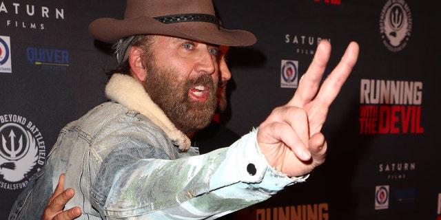 Nicolas Cage arrives at the premiere of Quiver Distribution's "Running with the Devil" at Writers Guild Theater on September 16, 2019, in Beverly Hills, Calif.