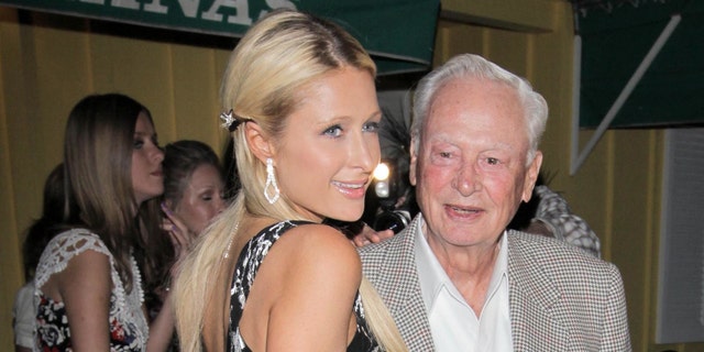Paris Hilton has dinner at Dan Tana with her grandfather, Barron Hilton, in 2014. (Photo by Philip Ramey/Corbis via Getty Images)
