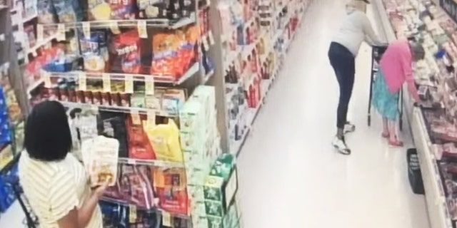 A woman filmed in an elderly victim's purse in a supermarket in southern California was filmed in front of a camera, police said on Wednesday.