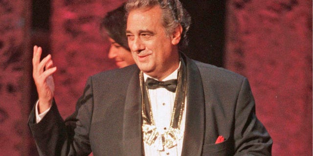 Placido Domingo acknowledges the audience after receiving the 1999 Hispanic Heritage Award at the John F. Kennedy Center for the Performing Arts in Washington.