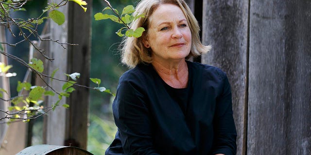 In this Friday, July 12, 2019 file photo, retired opera singer Patricia Wulf poses for a portrait at her home in Virginia. Wulf told the AP that Placido Domingo would confront her night after night when they performed together with the same whispered question, uttered very close to her face: “‘Patricia, do you have to go home tonight?’”