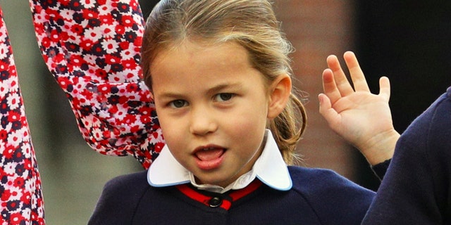 Britain's Princess Charlotte of Cambridge gestures as she arrives for her first day of school at Thomas's Battersea in London on Sept. 5, 2019.