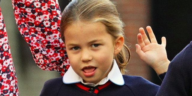 Britain's Princess Charlotte of Cambridge gestures as she arrives for her first day of school at Thomas's Battersea in London on Sept. 5, 2019.