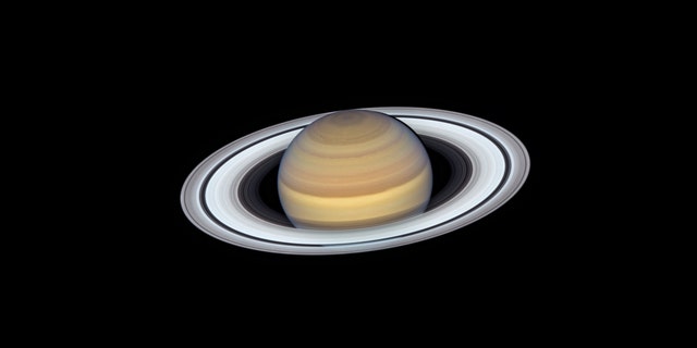 The latest view of Saturn from NASA's Hubble Space Telescope captures exquisite details of the ring system — which looks like a phonograph record with grooves that represent detailed structure within the rings — and atmospheric details that once could only be captured by spacecraft visiting the distant world. (Credits: NASA, ESA, A. Simon (GSFC), M.H. Wong (University of California, Berkeley) and the OPAL Team)