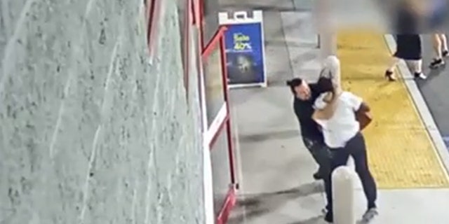 The Best Buy employee is seen on surveillance video chasing the man, trying to stop him before he got out the doors, but as they struggled over the bag, the suspect dragged the employee outside the store and into the parking lot.