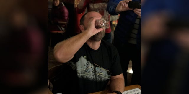 Nick Griffiths elicited cheers from the crowd as he took his "Sourtoe Cocktail" shot.