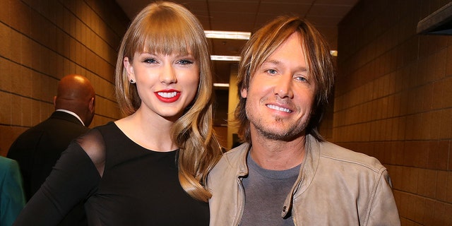 Taylor Swift and Keith Urban attend Tim McGraw's Superstar Summer Night presented by the Academy of Country Music at the MGM Grand Garden Arena on April 8, 2013, in Las Vegas. 