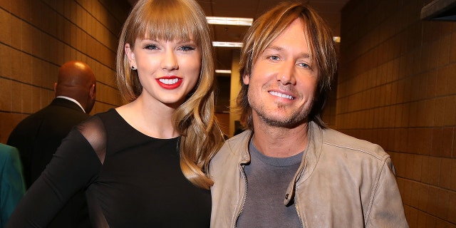 Taylor Swift and Keith Urban attend Tim McGraw's Superstar Summer Night presented by the Academy of Country Music at the MGM Grand Garden Arena on April 8, 2013, in Las Vegas.