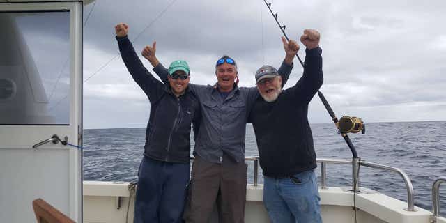 Darren O'Sullivan (left), David Edwards (center) and Henk Veldman (right) were able to catch, tag and release the first-ever bluefin tuna in waters off the south coast of Ireland.