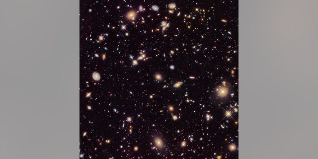 This image made available by the European Space agency shows galaxies in the Hubble Ultra Deep Field 2012, an improved version of the Hubble Ultra Deep Field image. A study published Sept. 12, 2019, uses a new technique to come up with a rate that the universe is expanding that is nearly 18 percent higher than the number scientists had been using since the year 2000. (Credit: NASA, ESA, R. Ellis (Caltech), HUDF 2012 Team via AP)