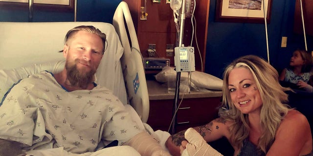 The bride and groom in the hospital following their serious motorcycle crash.