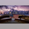 A U.S. flag hanging from a steel girder, damaged in the 9/11 attacks on the World Trade Center, blows in the breeze at a memorial in Jersey City, New Jersey, Sept. 11, 2019.