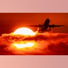 An aircraft passes the rising sun as it takes off at the international airport in Frankfurt, Germany, Sept. 2, 2019. 