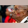 World War II veteran Lawrence Brooks sports a lipstick kiss on his cheek, planted by a member of the singing group Victory Belles, as he celebrates his 110th birthday at the National World War II Museum in New Orleans, Sept. 12, 2019.?
