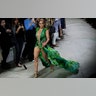 Actress Jennifer Lopez wears a creation as part of the Versace Spring-Summer 2020 collection, unveiled during the fashion week, in Milan, Italy, Sept. 20, 2019.?