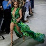 Actress Jennifer Lopez wears a creation as part of the Versace Spring-Summer 2020 collection, unveiled during the fashion week, in Milan, Italy, Sept. 20, 2019. 