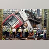 The Keikyu express train sits derailed after its collision with a truck in Yokohama, south of Tokyo, Sept. 5, 2019.