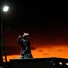 A man sets up a a light in preparation for an event inspired by the "Storm Area 51" i (AP Photo/John Locher)