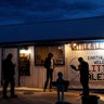 People stand around the Little A'Le'Inn during an event inspired by the "Storm Area 51" internet hoax, . (AP Photo/John Locher)