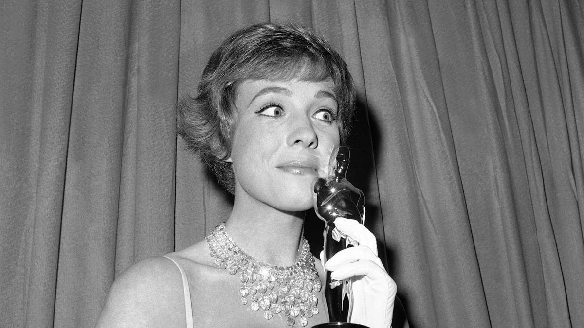 This April 6, 1965 file photo shows actress Julie Andrews holding her best actress Oscar for "Mary Poppins" in Santa Monica, Calif. (AP Photo, File)