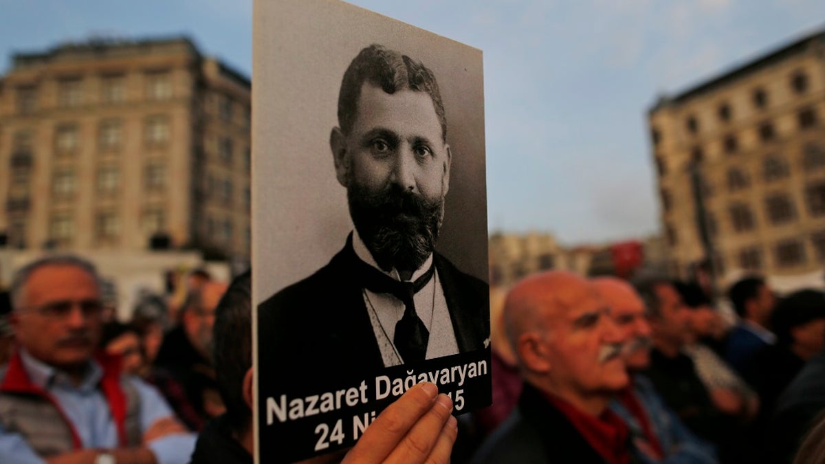 In this April 24, 2019, file photo, protesters hold portraits of Armenian intellectuals during a rally held to commemorate the 104th anniversary of the 1915 mass killing of Armenians in the Ottoman Turks in Istanbul. The House voted overwhelmingly to recognize the century-old mass killings of Armenians by Ottoman Turks as genocide. (AP Photo/Lefteris Pitarakis, File)