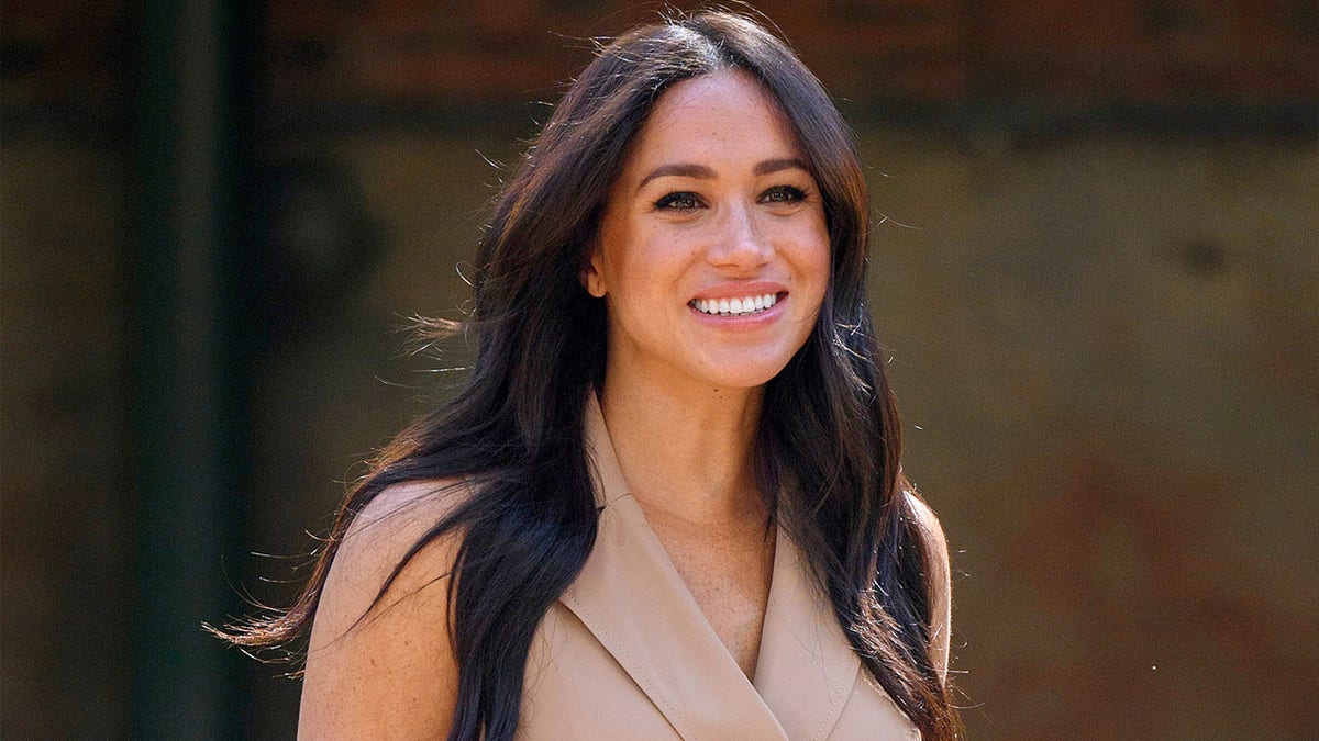 Meghan Markle smiles for a photo