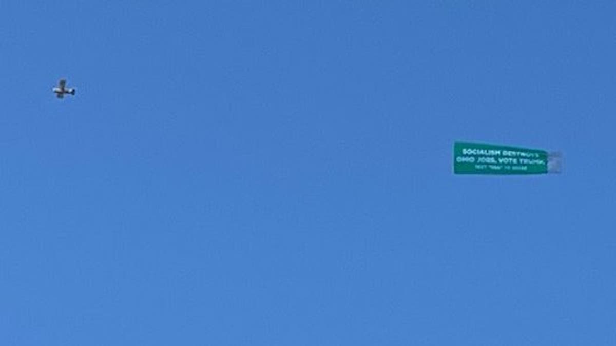 President Donald Trump's re-election campaign flies a banner reading “SOCIALISM DESTROYS OHIO JOBS. VOTE TRUMP" over the skies of Otterbein University, site of Tuesday night's fourth round Democratic primary debate, in Westerville, Ohio on Oct. 15, 2019