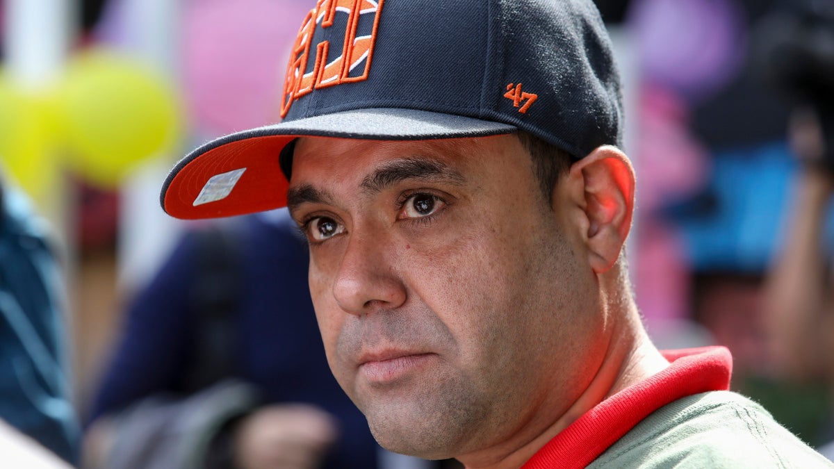 Miguel Perez Jr. listens to a supporter speaking at a news conference in Chicago on Tuesday, Sept. 24. Perez, an Army veteran who was deported to Mexico in 2018, was sworn in as a U.S. citizen on Friday. (AP Photo/Teresa Crawford)