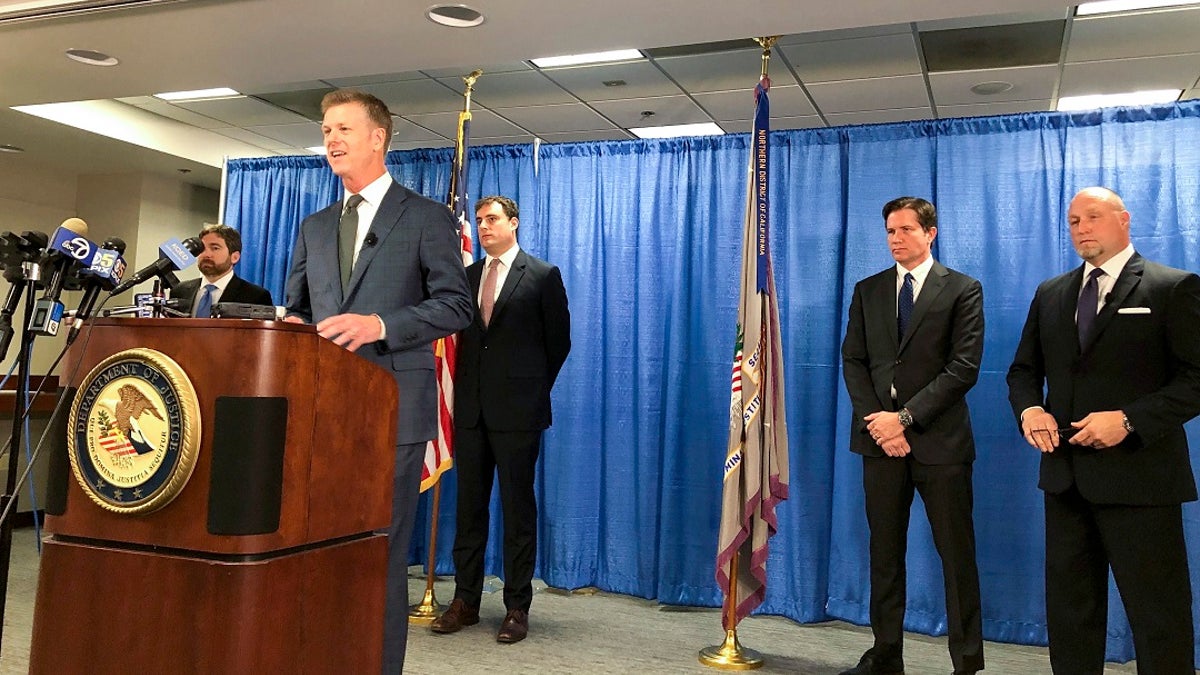 US attorney David Anderson announces criminal spy charges against a San Francisco Bay Area tour operator Xuehua Edward Peng Monday, Sept. 30, 2019, in San Francisco. Xuehua Edward Peng, who operates tours for Chinese students and visitors, was charged with being an illegal foreign agent and delivering classified U.S. national security information to officials in China, U.S. government officials announced Monday. (AP Photo/Janie Har)