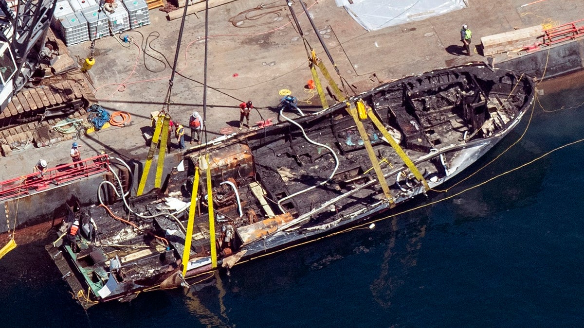 Te burned hull of the dive boat Conception. (Brian van der Brug/Los Angeles Times via AP, File)