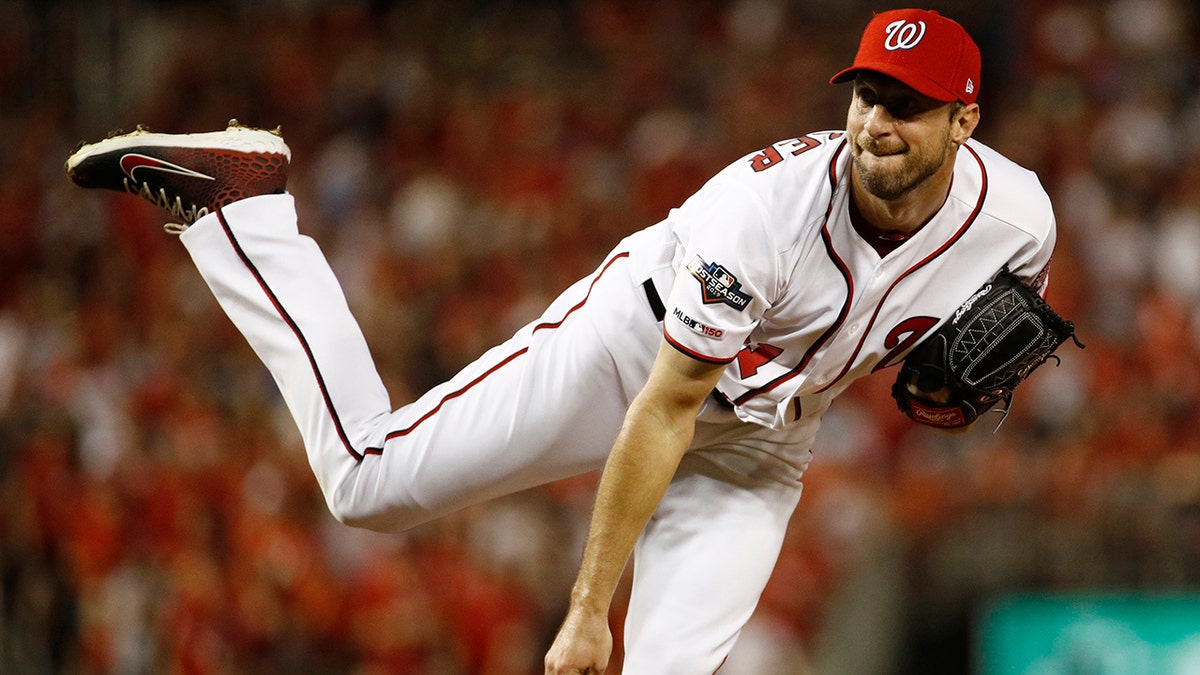 Washington Nationals starting pitcher Max Scherzer follows through on a pitch to the Milwaukee Brewers in the first inning of a National League wild card baseball game, Tuesday, Oct. 1, 2019, in Washington. (Associated Press)