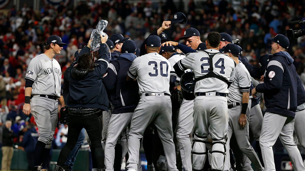 New York Yankees players celebrate after their 5-1 victory over the Minnesota Twins in Game 3 of a baseball American League Division Series, Monday, Oct. 7, 2019, in Minneapolis. (AP Photo/Bruce Kluckhohn)