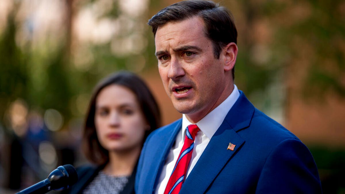 Attorney General for the Eastern District of Virginia G. Zachary Terwilliger, right, accompanied by Assistant United States Attorney Danya Atiyeh, left, announce the arrest of Henry Kyle Frese, a Defense Intelligence Agency official charged with leaking classified information to two journalists, including one he was dating, during a news conference outside the federal courthouse in Alexandria, Va., Wednesday, Oct. 9, 2019. The Associated Press.
