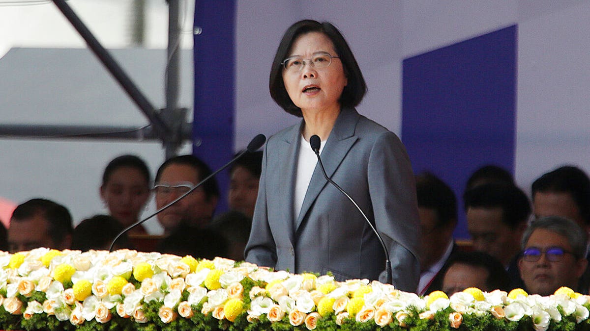 Taiwan President Tsai Ing-wen delivers a speech during National Day celebrations in front of the Presidential Building in Taipei, Taiwan, Thursday, Oct. 10, 2019. In the national day address, President Tsai said China was threatening the island "nonstop" and posing a major challenge to regional peace and stability. (AP Photo/Chiang Ying-ying)