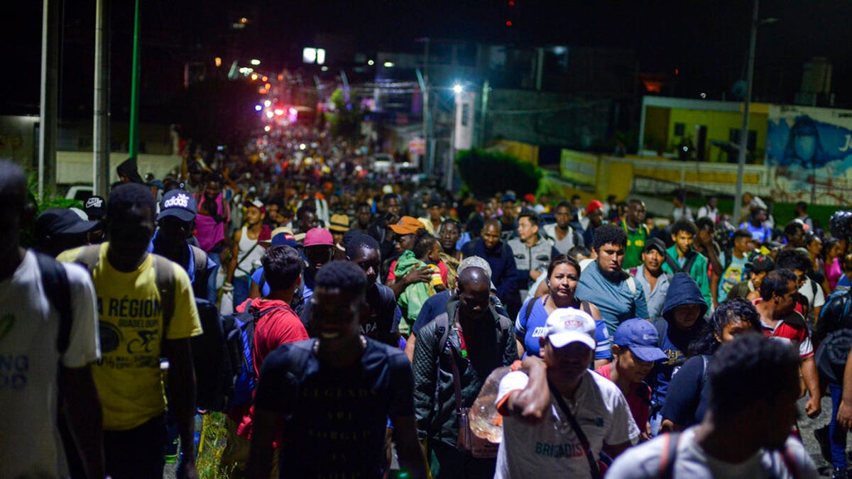 Migrants depart early in the morning from Tapachula, Chiapas state, Mexico, Saturday, Oct. 12, 2019. 