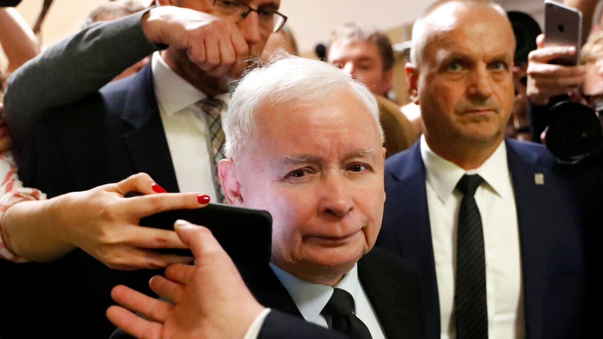 The ruling party leader Jaroslaw Kaczynski leaves a polling station after his vote in Warsaw, Poland, Sunday, Oct. 13, 2019. 