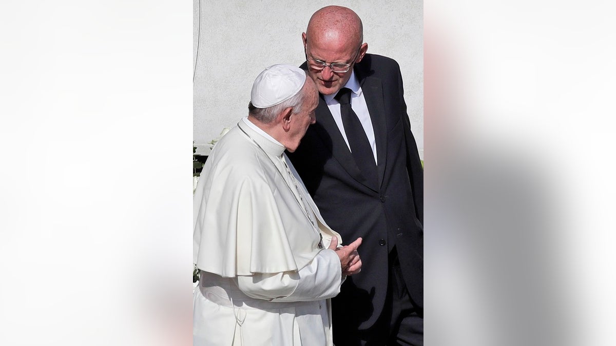 Vatican head of security Domenico Giani, right, shares a word with Pope Francis. (AP Photo/Alessandra Tarantino)