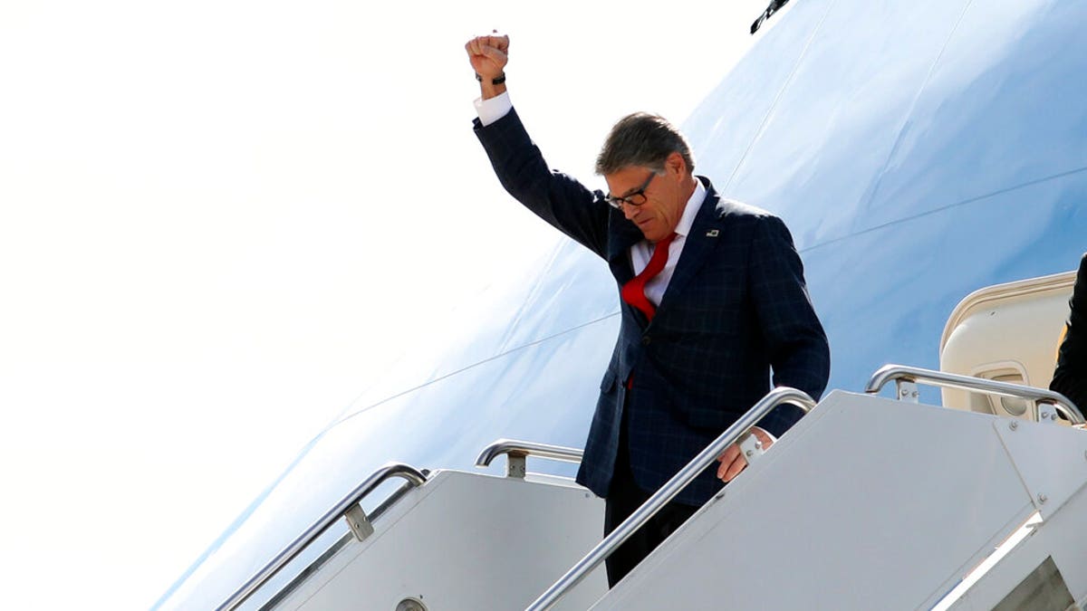Energy Secretary Rick Perry gesturing as he arrived on Air Force One with President Trump at Naval Air Station Joint Reserve Base in Fort Worth, Texas, on Thursday. (AP Photo/Andrew Harnik)