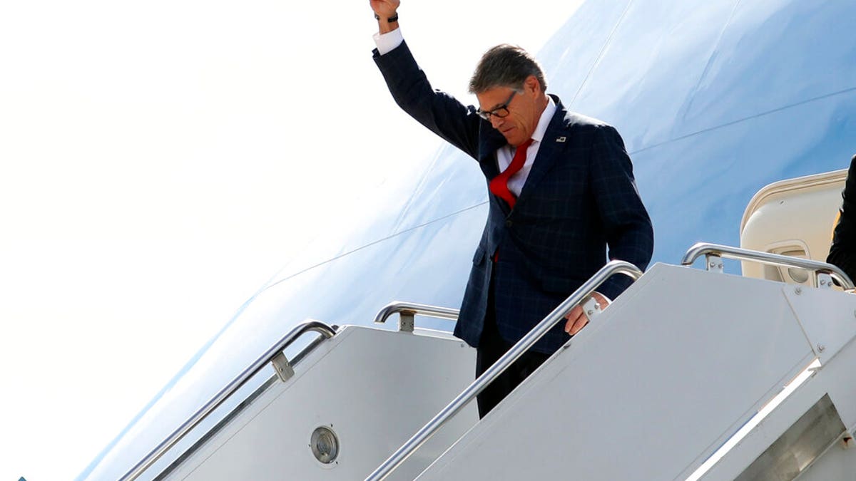 Energy Secretary Rick Perry gesturing as he arrived on Air Force One with President Trump at Naval Air Station Joint Reserve Base in Fort Worth, Texas, on Thursday. (AP Photo/Andrew Harnik)