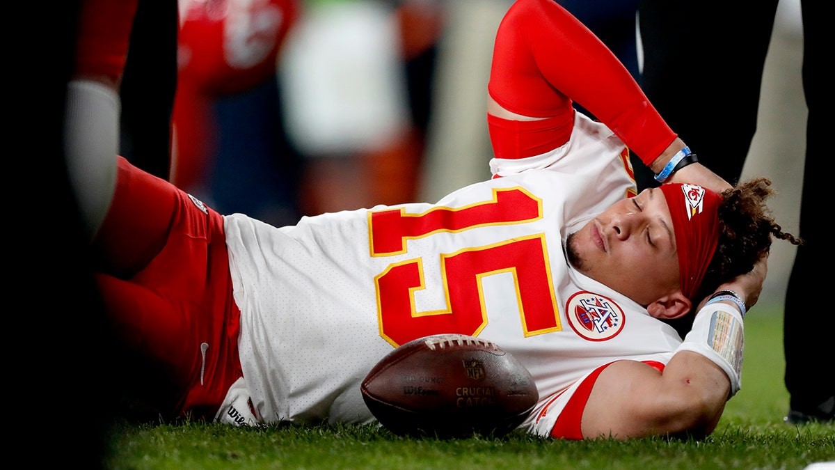 Kansas City Chiefs quarterback Patrick Mahomes (15) lies on the field after being injured against the Denver Broncos during the first half of an NFL football game, Thursday, Oct. 17, 2019, in Denver. (Associated Press)
