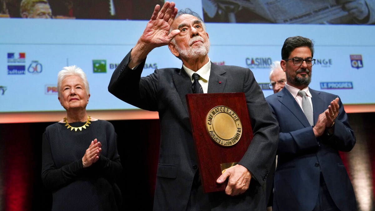 US director Francis Ford Coppola holds his award during the Lumiere Award ceremony of the 11th Lumiere Festival, in Lyon, central France. 