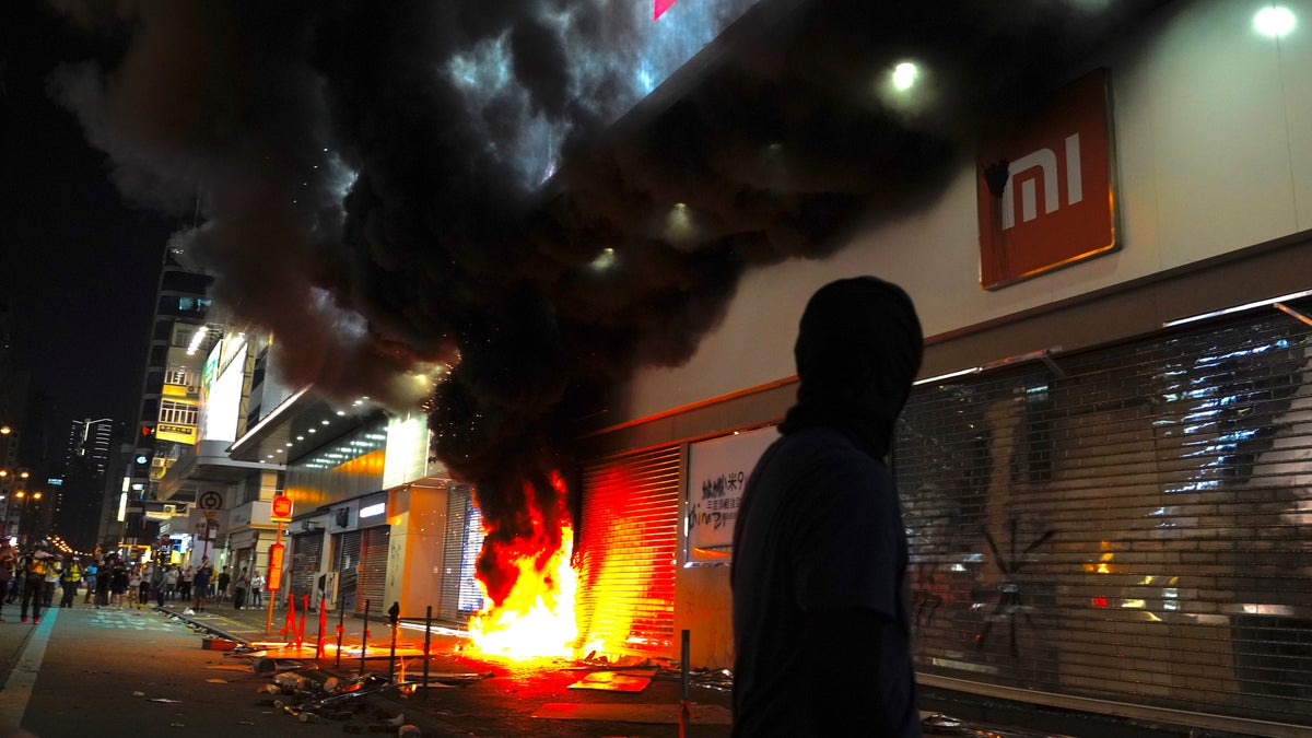 Protesters setting fire to a Xiaomi shop in Hong Kong this past Sunday. (AP Photo/Vincent Yu)
