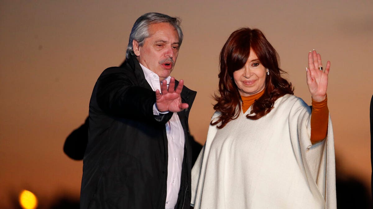 In this Oct. 17, 2019 photo, presidential candidate Alberto Fernandez, left, and running-mate Cristina Fernandez de Kirchner, wave to supporters at a campaign rally in Santa Rosa, Argentina.