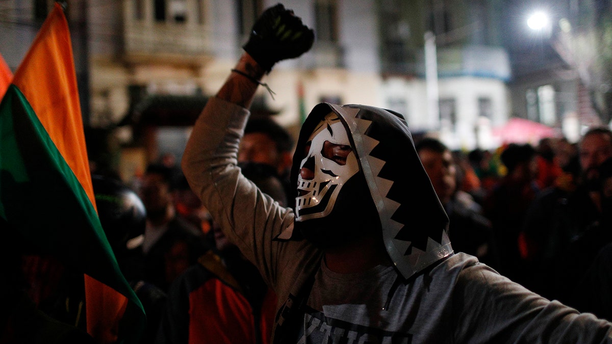Supporters of opposition presidential candidate Carlos Mesa, a former president, gather outside the Supreme Electoral Court where election ballots are being counted in La Paz.